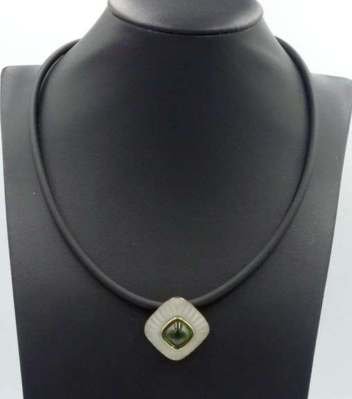 Cushion cut green tourmaline and rock crystal pendant on black leather cord
