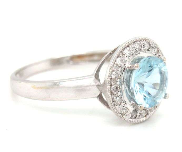 14kt White gold blue topaz and diamond ring