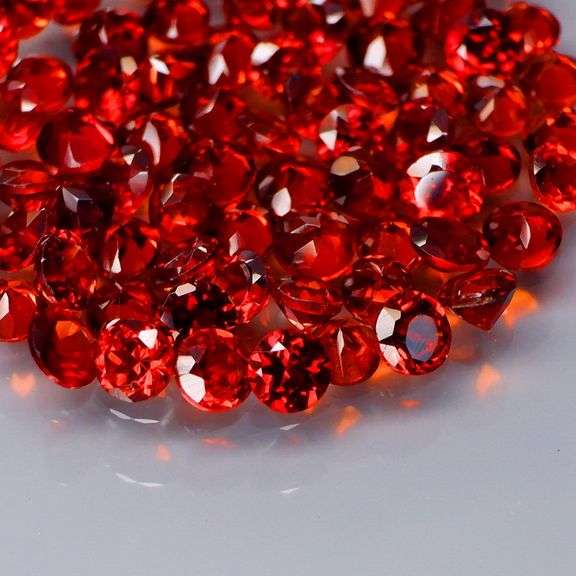 Outstanding 6.16ct diamond cut high fire Mozambique Garnet set