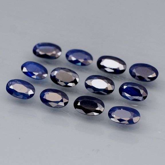 Beautifully colored 3.30ct ink blue Sapphire set