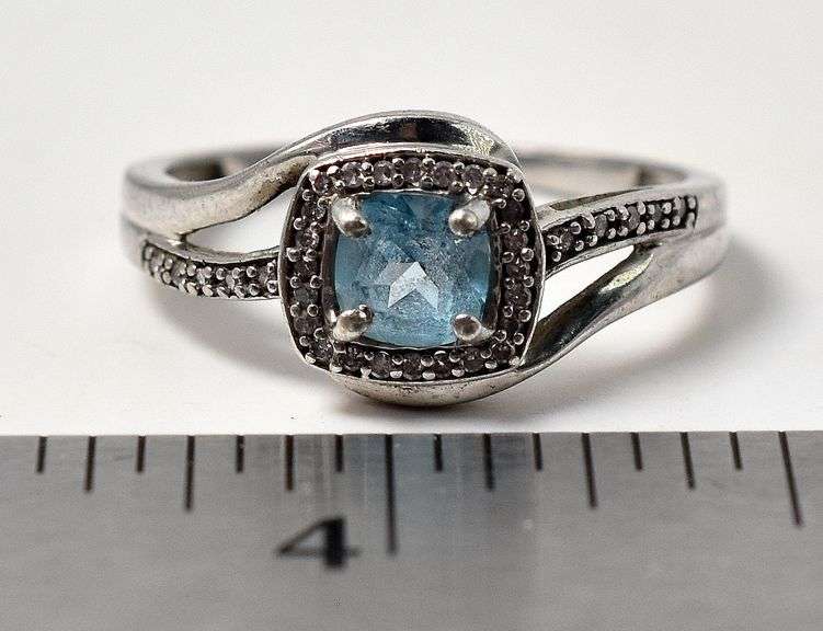 Blue Topaz Halo Ring in Sterling Silver