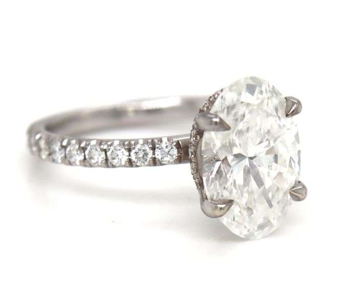 14kt White gold 3.15ct oval lab grown diamond in micro pave ring