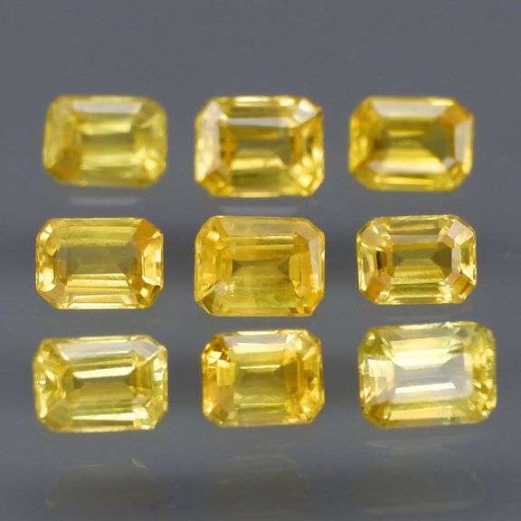 Incredible 2.25ct emerald cut yellow Sapphire set -Heated only!