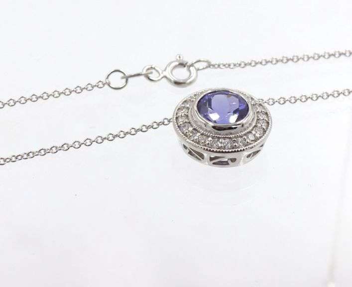 14kt White gold 2.02ct Tanzanite in 0.40ctw diamond halo setting pendant on chain