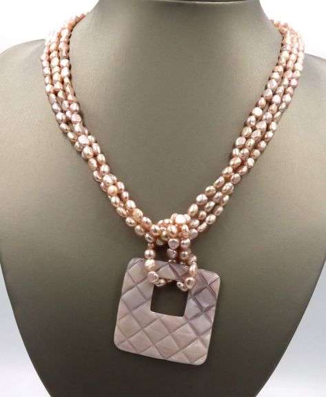 Pearl square pendant on multi strand pearl necklace