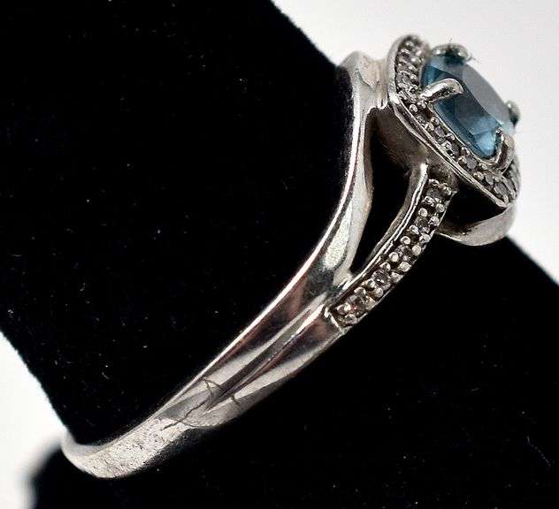 Blue Topaz Halo Ring in Sterling Silver