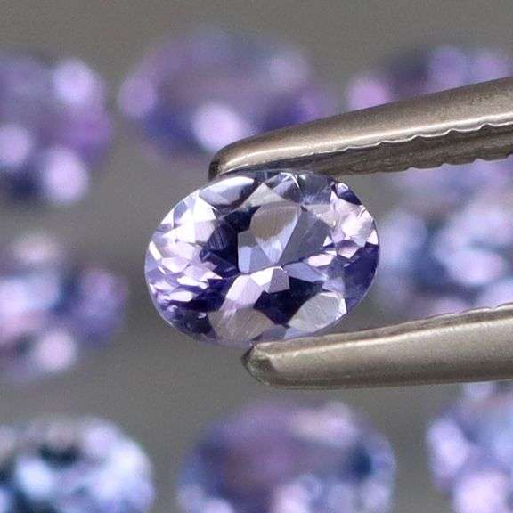 Heavy flashing 2ct oval cut Tanzanite set