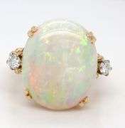 18kt Yellow gold 6.25ct oval opal and diamond ring