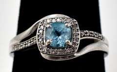 Blue Topaz Halo Ring in Sterling Silver