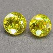 High grade 1.36ct matched set of multi-color flashing Sphenes!!!