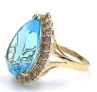 14kt Yellow gold 22ct pear blue topaz and 0.50ctw diamond halo ring