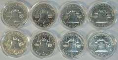 8 Assorted Gem Proof Franklin Half Dollars in capsules