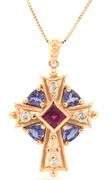 14kt Yellow gold Garnet, Tanzanite and diamond accent cross pendant on chain