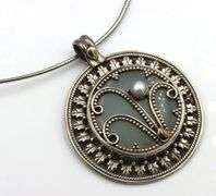 Vintage 925 sterling silver sunburst pendant on chain