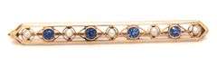 Antique Enamel, blue sapphire and pearl brooch in 14kt yellow gold