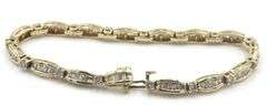 14kt Yellow gold 2.40ctw round brilliant and baguette diamond link station bracelet