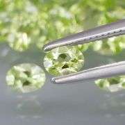 Dazzling 7.06ct untreated apple green Peridot set