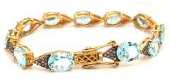 Fabulous 18.67CTW Oval Faceted Blue Topaz & Diamond Bracelet in 14K Yellow Gold Over Sterling Silver