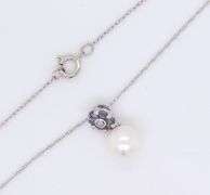 10kt White gold Pearl, Tanzanite and diamond pendant on chain