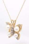 14kt Yellow gold pearl and diamond accent butterfly pendant on chain