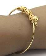 18kt Yellow gold charm bangle bracelet