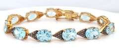 Fabulous 18.67CTW Oval Faceted Blue Topaz & Diamond Bracelet in 14K Yellow Gold Over Sterling Silver