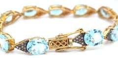 Fabulous 18.67CTW Oval Faceted Blue Topaz & Diamond Bracelet in 14K Yellow Gold Over Sterling Silver