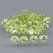 Dazzling 7.06ct untreated apple green Peridot set