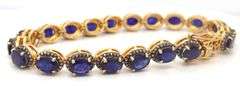 Captivating 19.30CTW Oval Faceted Blue Sapphire & 1.40CTW Diamond Bracelet in 14K Yellow Gold Over S