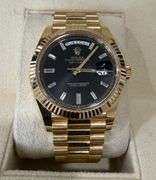 NEW! All original, Rolex Day-Date President 40mm – 18K Yellow Gold with Black Dial & Baguette Diamon