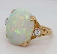 18kt Yellow gold 6.25ct oval opal and diamond ring