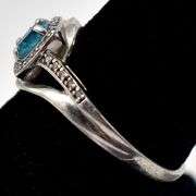 Blue Topaz Halo Ring in Sterling Silver