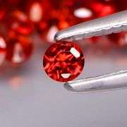 Outstanding 6.16ct diamond cut high fire Mozambique Garnet set