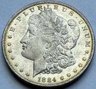 1884 O Frosty White BU Morgan Dollar