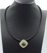 Cushion cut green tourmaline and rock crystal pendant on black leather cord