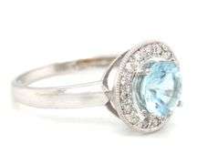 14kt White gold blue topaz and diamond ring