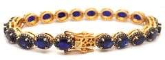 Captivating 19.30CTW Oval Faceted Blue Sapphire & 1.40CTW Diamond Bracelet in 14K Yellow Gold Over S
