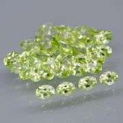 Dazzling 7.06ct untreated apple green Peridot set