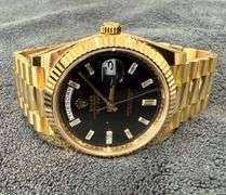 NEW! All original, Rolex Day-Date President 40mm – 18K Yellow Gold with Black Dial & Baguette Diamon