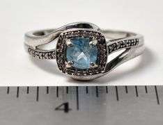 Blue Topaz Halo Ring in Sterling Silver