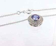 14kt White gold 2.02ct Tanzanite in 0.40ctw diamond halo setting pendant on chain