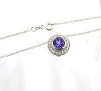 14kt White gold 2.02ct Tanzanite in 0.40ctw diamond halo setting pendant on chain