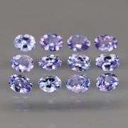 Heavy flashing 2ct oval cut Tanzanite set