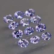 Heavy flashing 2.22ct oval cut Tanzanite set