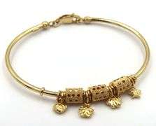 18kt Yellow gold charm bangle bracelet