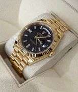 NEW! All original, Rolex Day-Date President 40mm – 18K Yellow Gold with Black Dial & Baguette Diamon