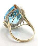 14kt Yellow gold 22ct pear blue topaz and 0.50ctw diamond halo ring