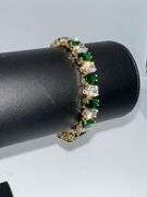 18 Kt White Gold Plated Huge 32.5 Ctw Lab Simulated Diamond and Green Emerald Tennis Bracelet