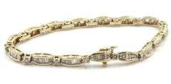 14kt Yellow gold 2.40ctw round brilliant and baguette diamond link station bracelet