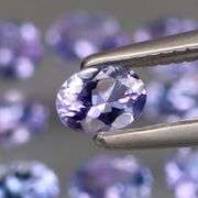 Heavy flashing 2ct oval cut Tanzanite set